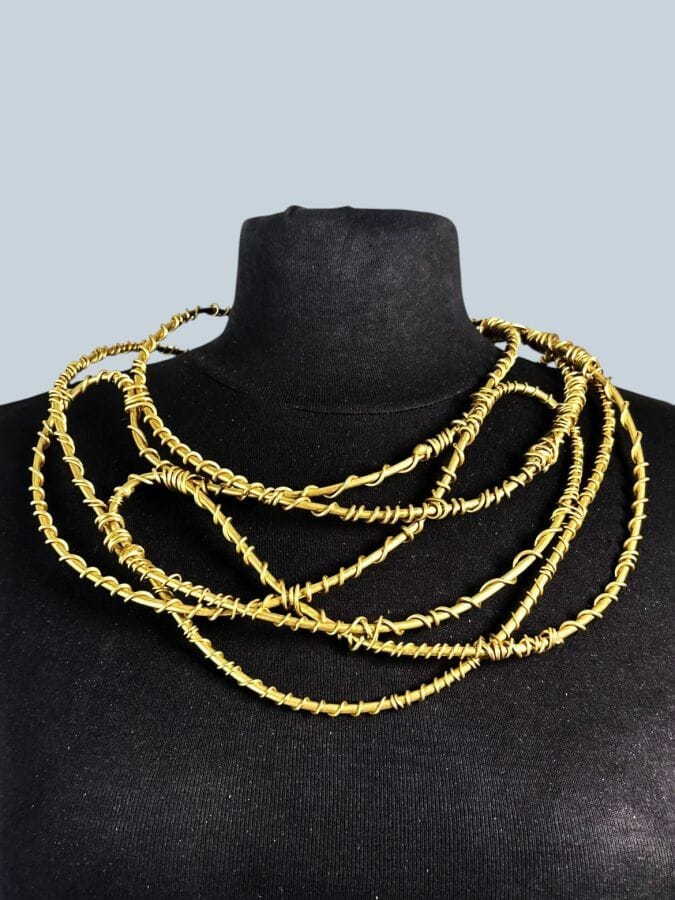 20th-Century Modernist School Necklace with brass-wire arabesques—unsigned 
Diameter: 13 cm  
Height: 22 cm 
Width: 13 cm
