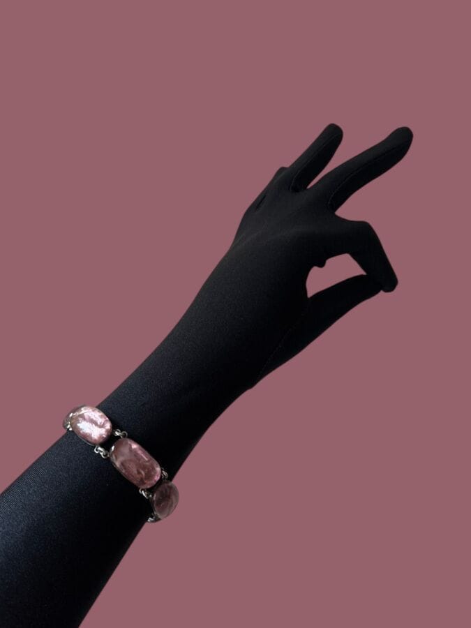 JACQUES GAUTIER Silver plated metal bracelet with pink enamel gadroons—signed
Length: 18 cm