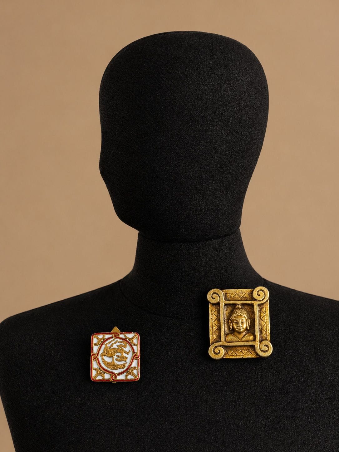 JEANNE PERAL Lapel pin with Cambodian-style design on the reverse, in patinated gilded bronze 
Unsigned
5.5 x 4.5 cm
Lapel pin in patinated metal with a medieval motif in white and brown enamel 
Signed
3.5 x 3.5 cm