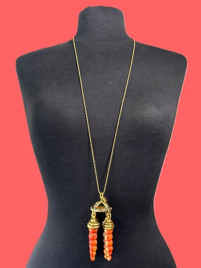 MARIA BARON Beaded necklace with a spinning top pendant made of gold-plated metal and resin, accented with coral—branded 
Necklace length: 86 cm
Pendant length: 10.5 cm