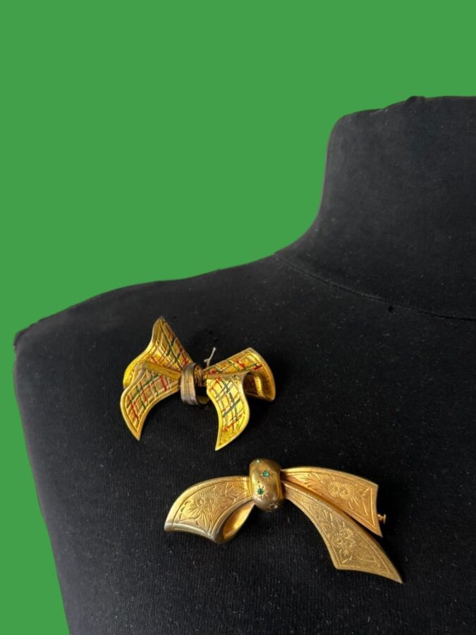 PAUL WIEGANT Made in France  Two  Gold-plated metal bow brooches with enamel accents and small green rhinestones—monogrammed                                                                                                                                                                    Length: 7 cm and 5 cm
(1 rhinestone missing)
