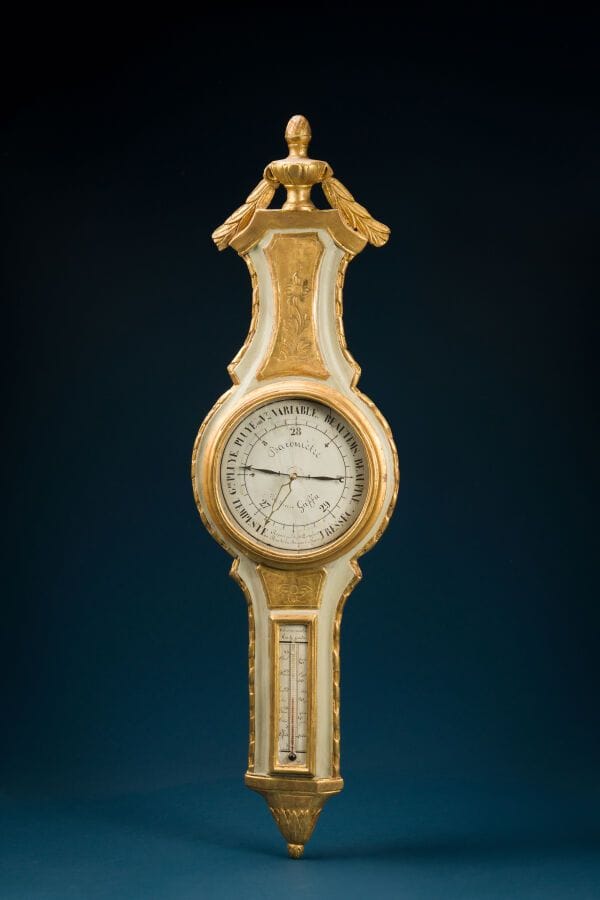 Green and gold lacquered wooden barometer and thermometer decorated with vases and flowers. 
Work by Pierre GAFFON, Rue de la Bourse in Paris, late 18th century 
Height: 108 cm. 
(Cracked glass)