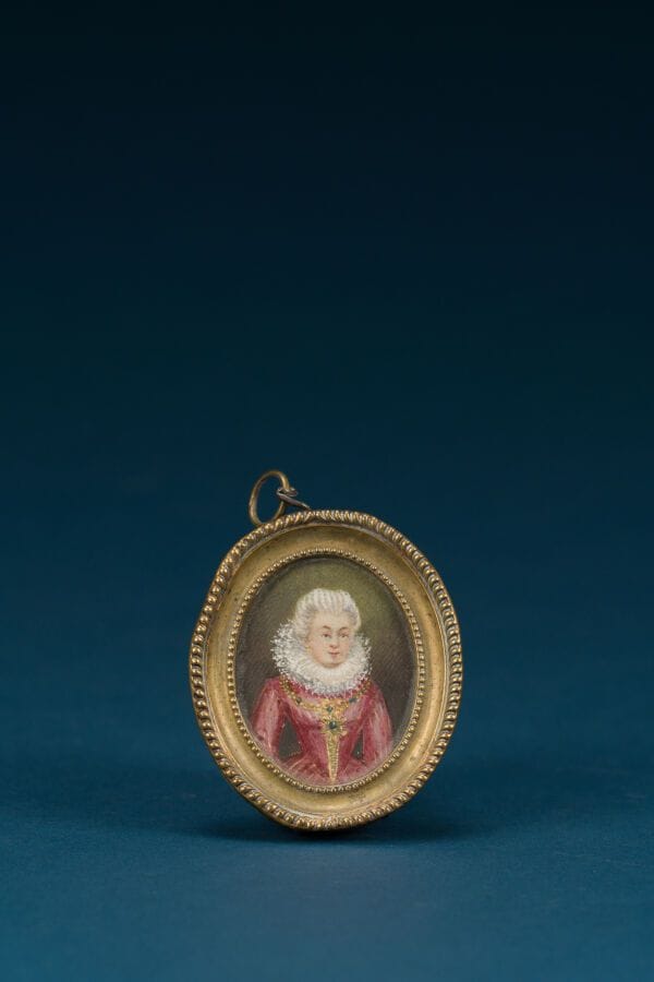 French School, in the 18th-century style 
"Portrait of a Woman in a Red Dress and Wreath"
Oval miniature 
4.5 x 3.4 cm.