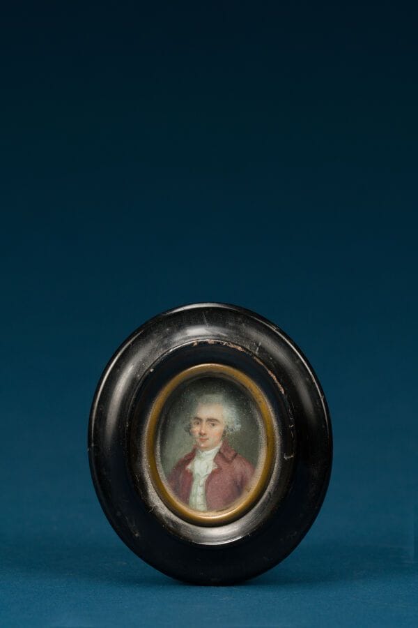 French School, late 18th century 
"Man in a Red Frock Coat"
Oval miniature 
 4 x 3 cm.