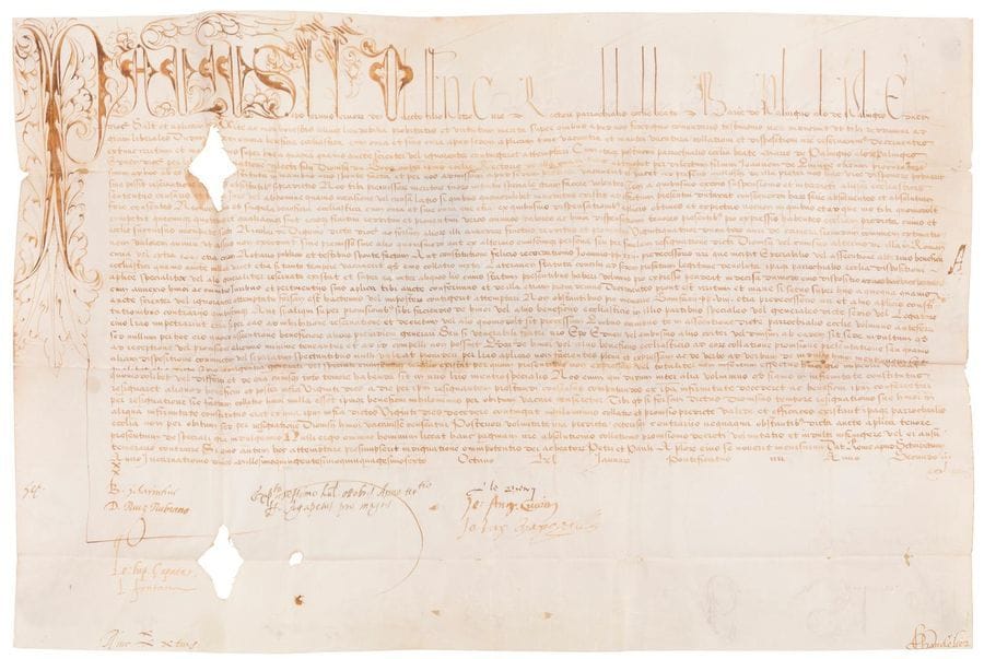 Gian Pietro Carafa, Paul IV (1476-1559) Pape en 1555. Bulle manuscrite en son nom, Rome à Saint-Pierre 8e des calendes de janvier (24 décembre) 1556, 2e année de son pontificat ; vélin in-plano (35,5 x 51 cm), « Paulus » en grandes lettres ornées (trous, dont un dans le texte affectant quelques mots) ; sceau manquant ; en latin.
   En faveur de Pierre Cure, recteur de l’église de Notre-Dame de Palinges, du diocèse d’Autun (Saône-et-Loire), pour lui en accorder le bénéfice avec sa succursale de Saint-Nicolas de Digoin, moyennant une taxe de 24 ducats.