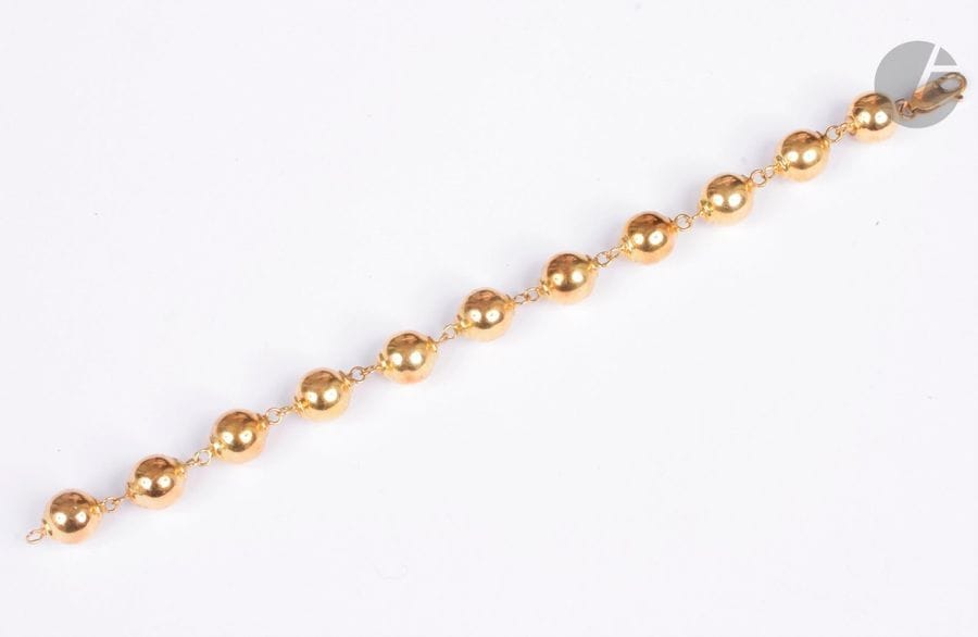 Bracelet en or jaune 18K (750), articulé de boules. Longueur : 20 cm environ. Poids : 20,8 g