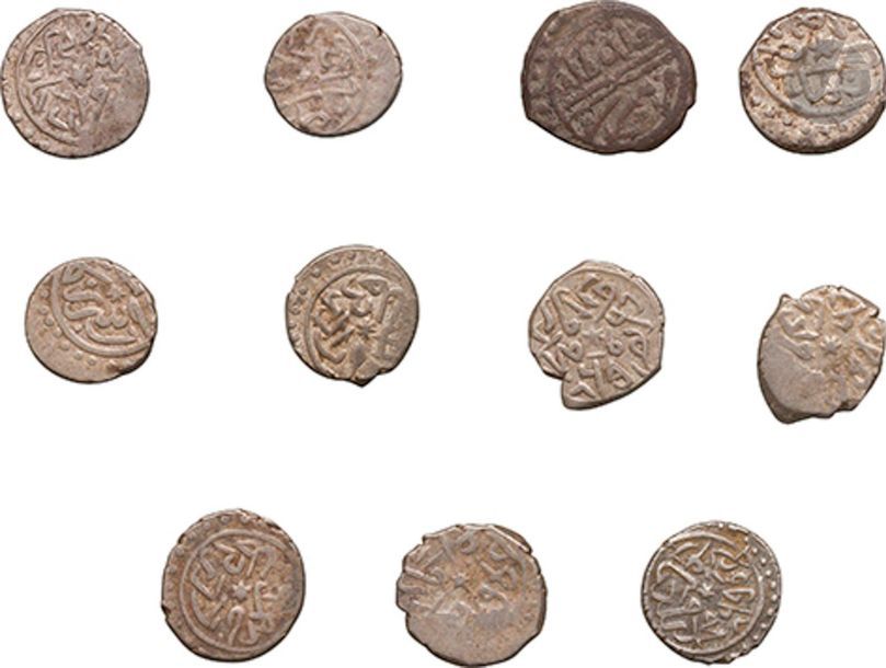11 monnaies ottomanes en argent. Illisibles. État moyen, rognées.