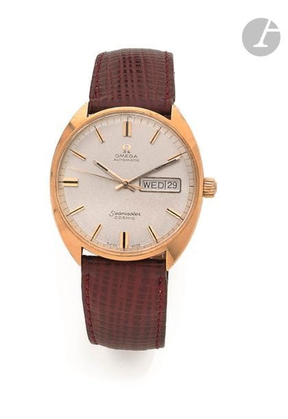 OMEGA Seamaster Cosmic. Vers 1970
N° 166036
Montre bracelet pour homme en or jaune 18K (750), cadran doré, index bâtons appliqués formant les heures, jours dates par guichet à 3h, mouvement mécanique à remontage automatique calibre 752, N° 27643254 , bracelet cuir avec une boucle ardillon en plaqué or siglée. 
Cadran, boîtier et mouvement signés.
Diamètre : 35 mm
Poids brut : 57 g