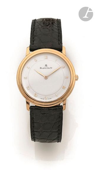 BLANCPAIN. Vers 1990
N° 2905
Montre bracelet pour homme en or jaune 18K (750), cadran blanc index chiffres romains formant les heures, mouvement à remontage mécanique calibre 21, fond squelette laissant voir le mouvement, bracelet cuir avec sa boucle ardillon en or jaune 18K signée.
Cadran, boîtier et mouvement signés.
Diamètre : 33 mm
Poids brut : 40,5 g