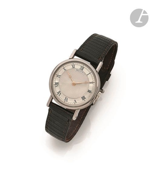 BREGUET Empire N° 3144. Vers 1967
Montre bracelet pour homme en or gris 18K (750), cadran guilloché en argent, index chiffres romains formant les heures, aiguilles Breguet en or, mouvement à remontage mécanique calibre Peseux 320, bracelet cuir avec sa boucle d’origine en or gris 18K. 
Cadran, boîtier et mouvement signés.
Diamètre : 30 mm
Poids brut : 36,2 g

Nous remercions la maison Breguet pour nous avoir confirmé ces renseignements, et tout particulièrement M. Emmanuel Breguet.