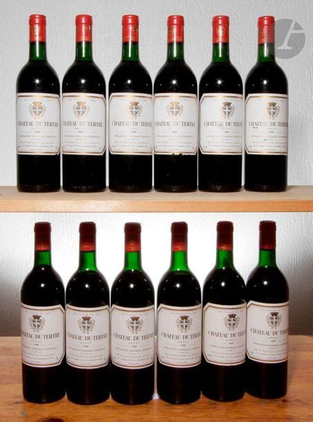 12 B CHÂTEAU DU TERTRE (Caisse bois d'origine) 7 B.G ; 3 T.L.B ; 2 H.E.+ ; quelques accrocs bas de capsules, GCC5 Margaux, 1986