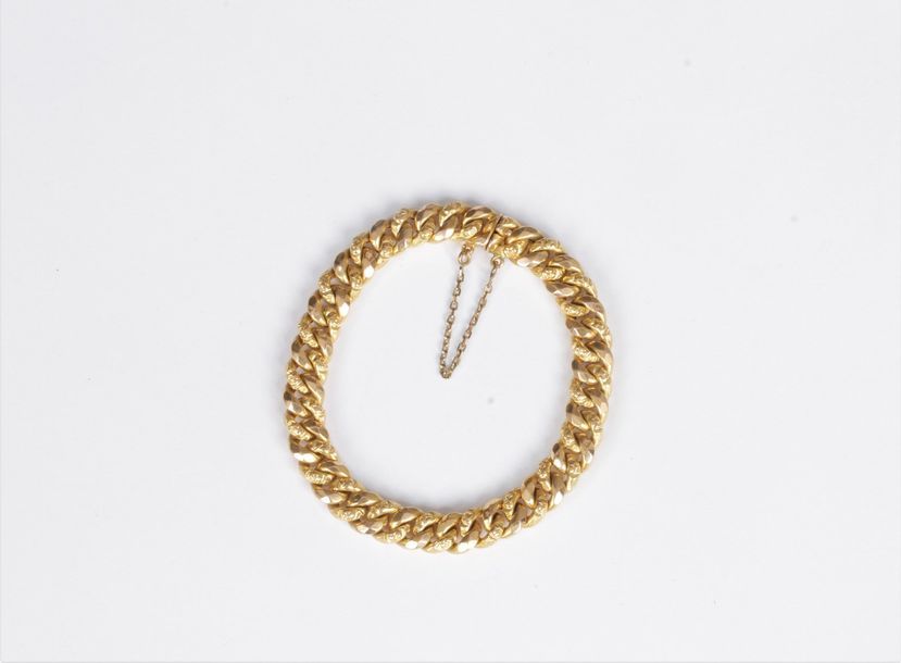 Bracelet en or 18K (750), maillons gourmette. Poids : 11,4 g