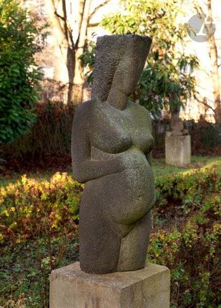 ACHIAM (1916-2005)
Femme enceinte, 1952
Sculpture en basalte - Taille directe.
Non signée.
108 x 40 x 30 cm

Exposition : 
- Salon de la Jeune Sculpture, Paris, 1952.
- Formes Humaines, Paris, 1964.
- Galerie Paul Ambroise, Paris, 1965 et 1976.
- Fondation Pierre de Coubertin, Saint-Rémy-lès-Chevreuse, 1988.
- Mont-de-Marsan, 1994.
- L’Expo dans la rue, Sèvres, 1998.

Bibliographie : 
- André Flament, Achiam. Sculptures et poèmes, Paris, Éditions de l’Archipel, 1979, p. 27.
- Achiam, catalogue de l’exposition, Meudon, Musée d’Art et d’Histoire, 1992, p. 26.
- Achiam at Tefen, catalogue de l’exposition, Tefen, The Open Museum - Industrial Park, p. 9.
- Anne-Marie Anthony, Achiam sculpteur. Une vie, Paris, Éditions Publibook, 2010, p. 76.