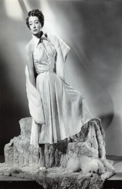 Joan Crawford dans Humoresque (1946), Sudden Fear (1952) et Réunion in France (1942). Sept épreuves d'exploitation d'époque. 20,5 x 25,5 cm.