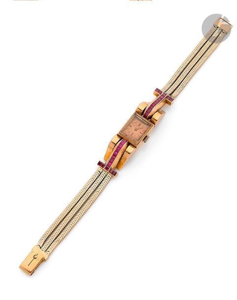 ROLEX. Circa
 1940Women's 18K (750) yellow gold bracelet
 watch,
 made for the French market. Painted dial (accident), hour-markers forming the hours. Signed mechanical winding movement. Tubogaz type bracelet in integrated yellow gold, winding attachments set with
 calibrated
 synthetic rubies
. Signed

 dial and movement

.

 Length:

 18 cmGross weight

: 43.4 g

