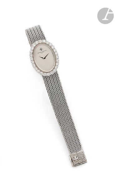 VACHERON & CONSTANTIN. circa 1970N 509889 P 
Ladies' wristwatch in 18K (750) white gold, bezel set with brilliant-cut diamonds, white dial, mechanical winding movement, integrated 18K white gold bracelet with
 signature pin 
buckle
. Signed 

dial, case and

 movement.

 Diameter:

 19 mm x 24 mmLength: 15
 cmRough
 weight
: 27
.4 gThe

 watch comes with its case

.
