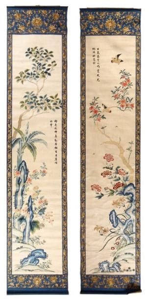 Deux broderies de soie en hauteur, l'une à décor d'un couple d'oiseaux perchés sur une branche de pivoines fl euries et papillons survolant un rocher percé, l'autre de rocher percé fl euri de pivoines, chrysanthèmes et cerisiers. Bordure en soie à décor brodé de lotus stylisés et rinceaux. Chine, XIXe siècle. (Taches). 206 x 44 cm.