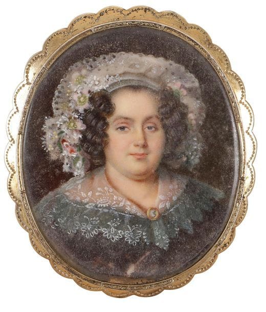 Attributed to Louis-François AUBRY(Paris 1767 - 1851
)Woman with a lace headdress decorated with flowers, in front bust, in a blue dress with a lace collar
closed by a cameoFine

miniature on ivory circa 1825 - 1830, trace of

signature

on

the left.


Oval on a gilt metal brooch,








mother of pearl lapel.



6 x











5.1 cm




(Brooch not open for inspection; small detachment at the bottom and dust














).





Total weight: 19.7 g

















