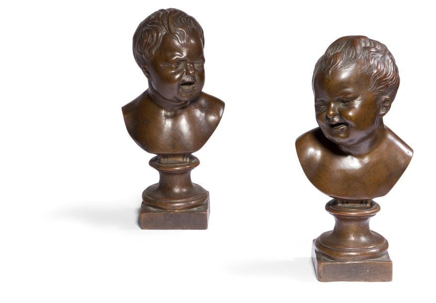 École FRANÇAISE du XIXe siècle
Jean qui rit et jean qui pleure
Paire de petits bustes en bronze à patine brune
Porte la signature « C. Garnier ciseleur « 
H : 22 cm