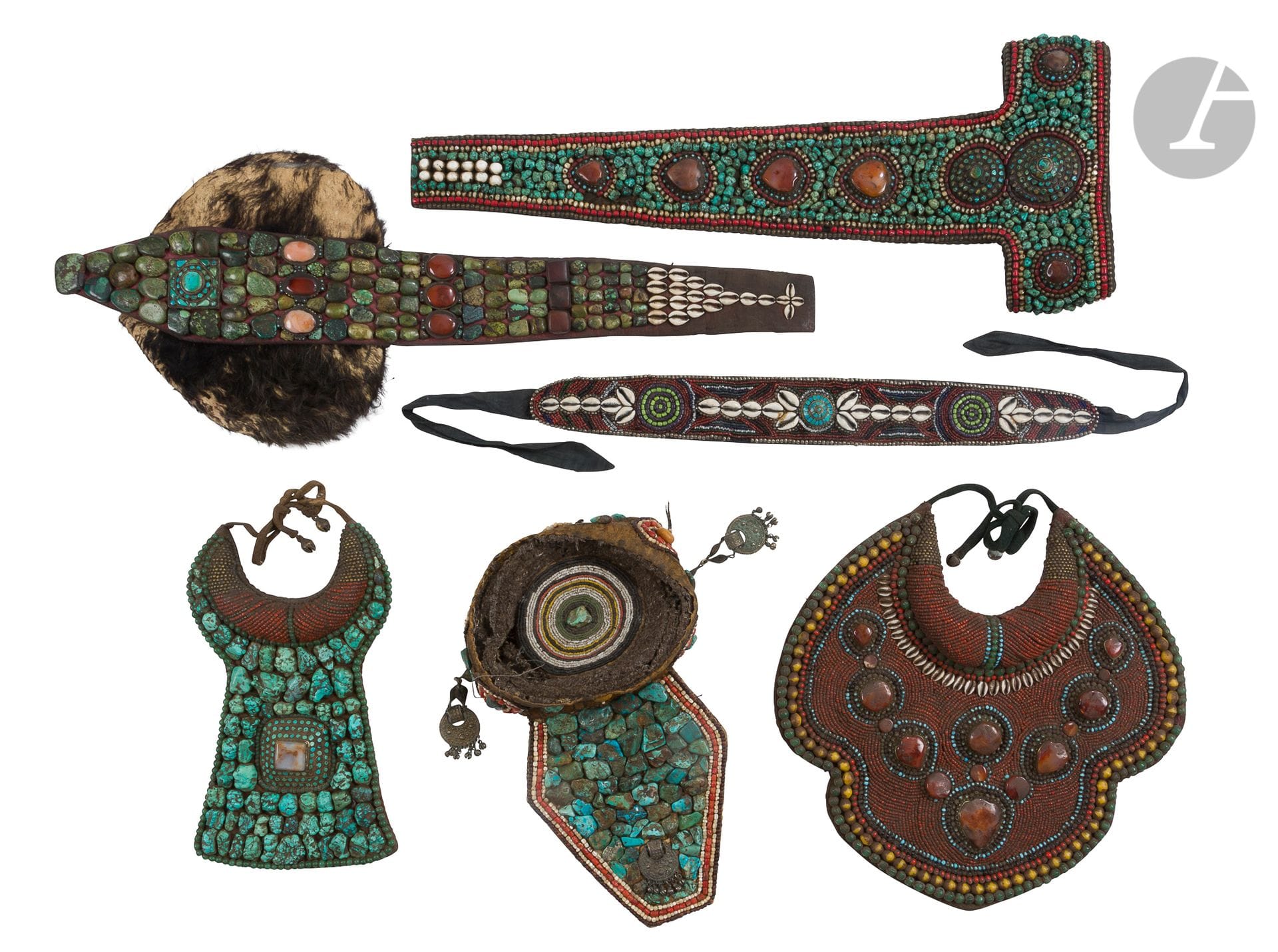 
Six ethnic ornamental ornaments, Tibet and Ladakh, 20th century



A perak type headdress, a turban headdress, a headdress called "trapper's hat", two breastplate necklaces, a belt element. The ensemble is decorated with turquoise, coral, glass, carnelian and cowrie stones.





Lots 271 - 275 : 

For obvious reasons of simplicity of our descriptions we have used the terms: headdress, tiara, plastron and pectoral, as for example for the tiara of lot 271 given sometimes as a female oracle's headdress, a nobleman's or king's tiara, or as a llama's tiara worn during funeral ceremonies. But also for the toque of lot 275 which can be given as a perak headdress, Ladakh, Zanskar, woman's headdress, Nubra valley, Changthang highland headdress, or Hunza headdress, Pakistan. And even if many museums, such as the Castre Museum in Cannes (now the Museum of World Explorations), the Natural History Museum of Lyon, or the Mingei International Museum of San Diego in California, present similar headdresses, following the controversies of these last years on this subject, nothing allows us, today, to affirm that these pieces were worn by members of ethnic groups of Ladakh or other regions of the Himalayan foothills. We will therefore consider that these pieces are presented only as decorative objects of the 20th century.
