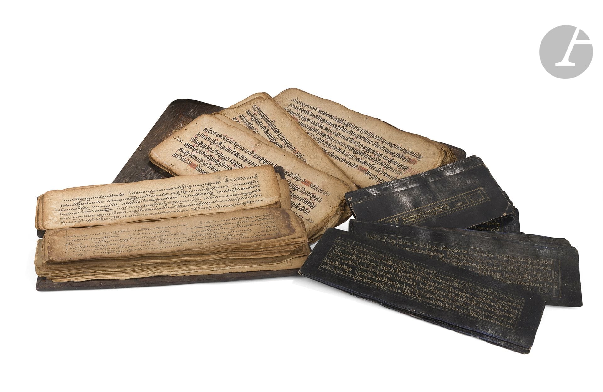 Four Sanskrit prayer books, Tibet, 20th centuryTwo
with wooden covers and two with black lacquered paper and yellow writing.
From 13 to 34 cm

