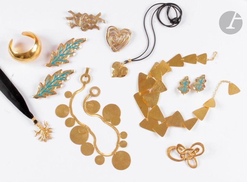 Costume jewelry set including: 5 brooches, 1 cuff bracelet, 1 pair of ear clips, 4 necklaces