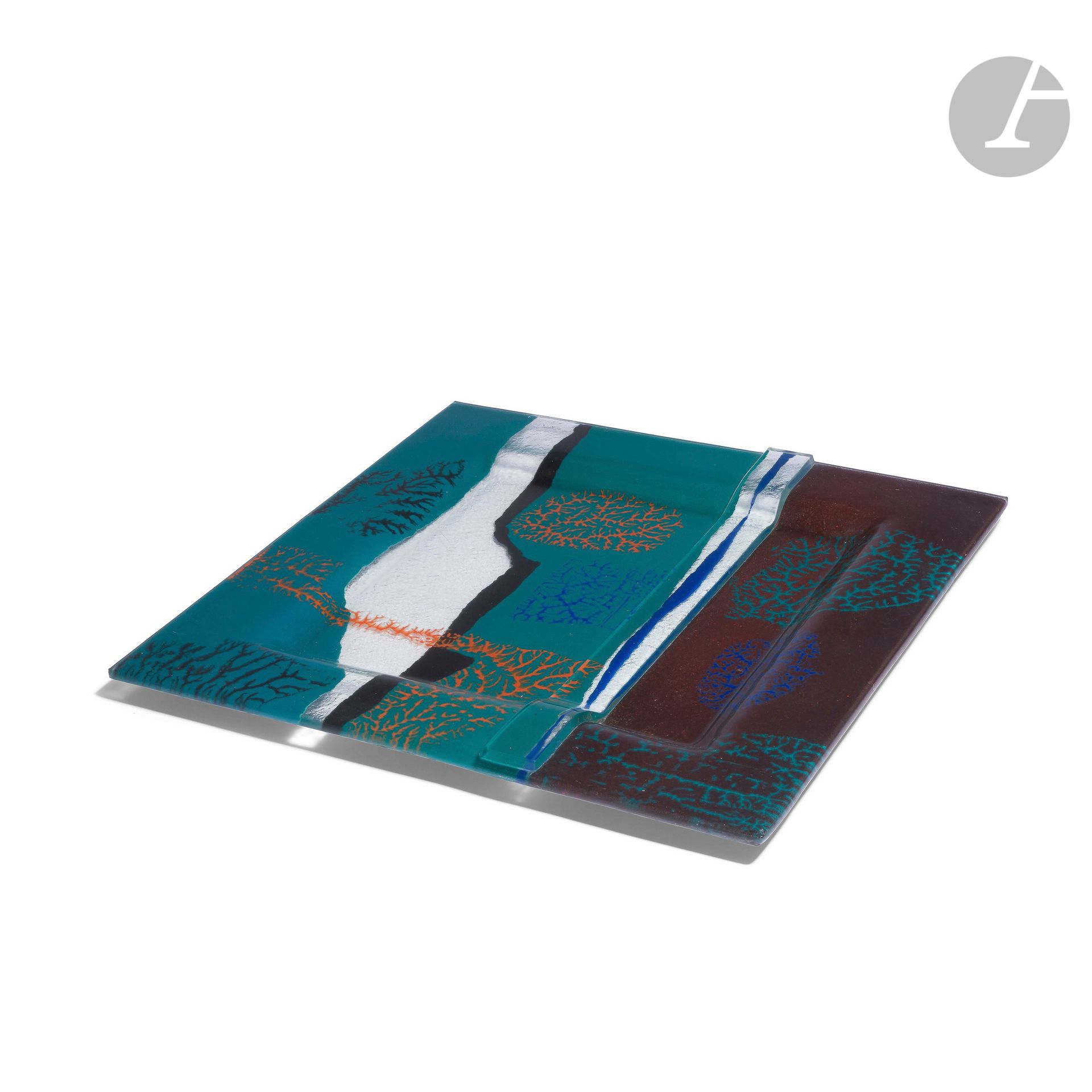 JEAN-CLAUDE OURDOUILLIE [French] (born 1949
)Large square dish in enamelled thermoformed glass in rust, blue and turquoise tones. A glass band applied to the surface. Signed on the edge. Made around 1990. 
W. 44 cm - D. 44 cm

