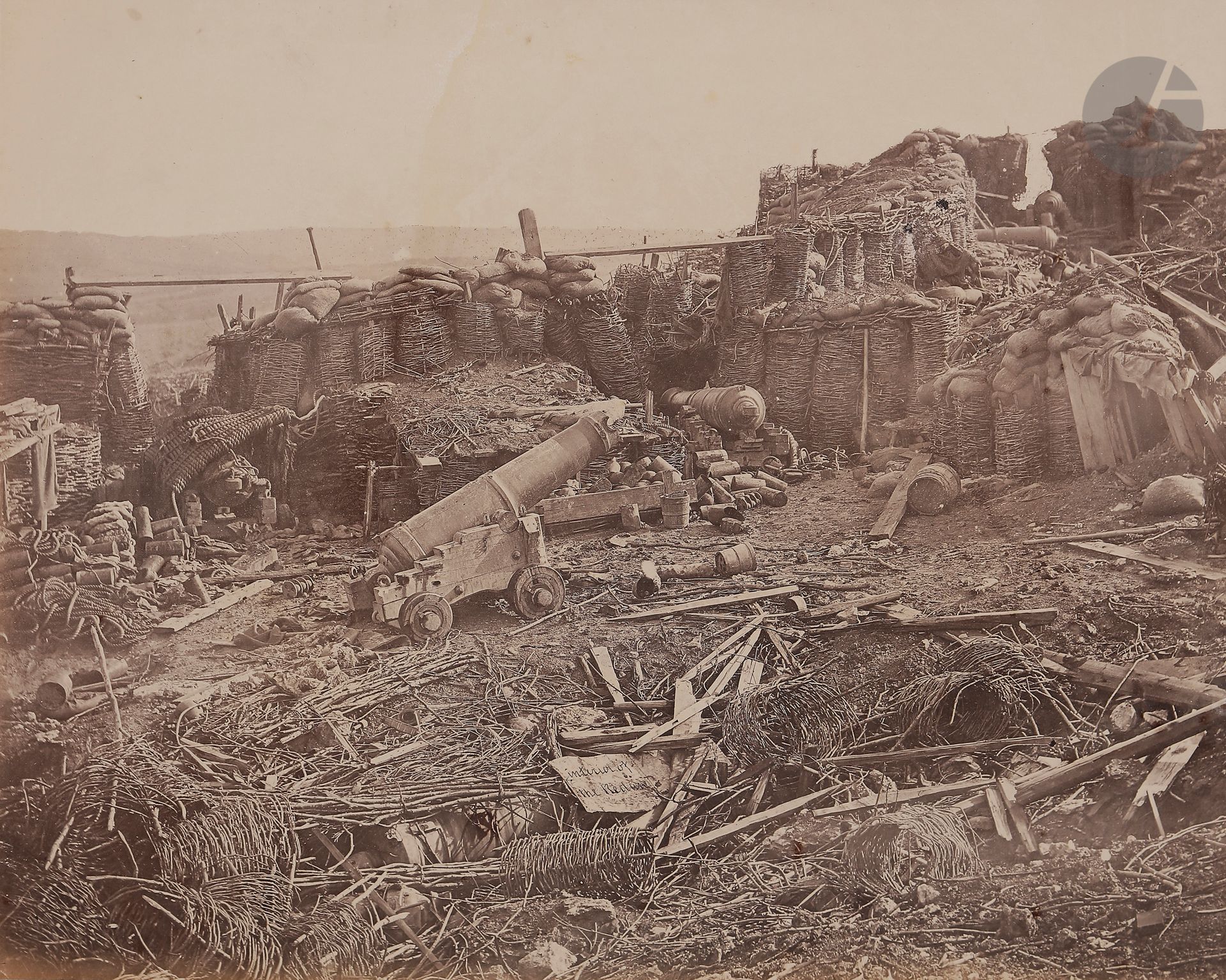 James Robertson (1813-1888) 
Guerre de Crimée. Sébastopol, 1855. 
Interior of the Redan. 
Épreuve sur papier salé, d’après négatif verre à l’albumine, contrecollée sur carton. Légende manuscrite dans le négatif au centre. 
23,2 x 28,5 cm

James Robertson (1813-1888) 
Crimean War, Sebastopol, 1855. 
Interior of the Redan. 
Salt print, from albumen glass plate negative, mounted on cardboard. Handwritten caption in the negative in the center. 
23.2 x 28.5 cm