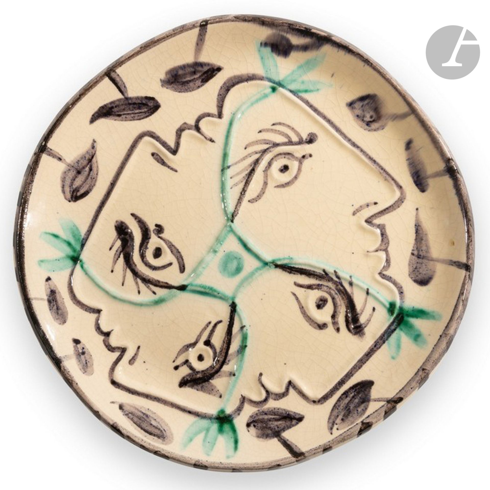 PABLO PICASSO (1881-1973) & ATELIER MADOURA 
Quatre profils enlacés, le modèle créé en [1949]
Assiette ronde-carrée.
Empreinte originale limitée, éditée et réalisée à vingt-cinq exemplaires chez Madoura. 
Épreuve en terre de faïence blanche, le décor aux engobes sous couverte ; noir, vert.
Le revers présentant un décor.
Porte les cachets en creux Empreinte Originale de PICASSO et MADOURA Plein Feu au revers. 
Diamètre : 26 cm

Provenance :
Collection particulière, région Centre-Val de Loire, France.

Bibliographie :
Alain Ramié - Picasso, catalogue de l’œuvre céramique édité 1947-1971 - Éditions Madoura, 1988. Modèle identique reproduit page 54 et référencé sous le numéro 86.