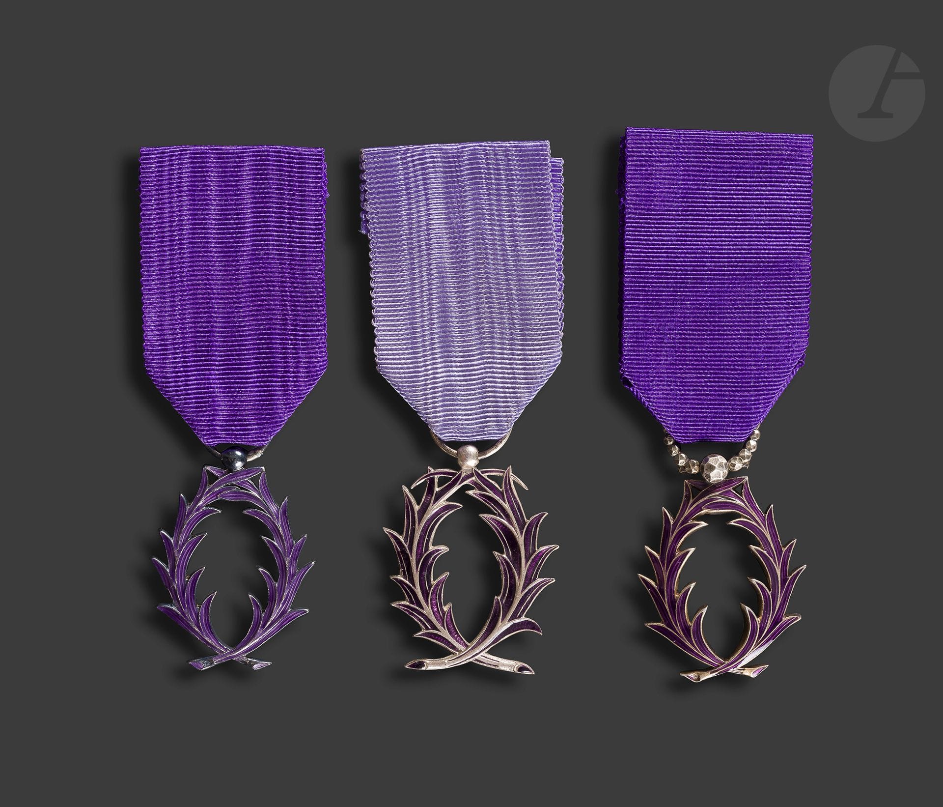 FRANCE 
ORDER OF ACADEMIC PALMS 
Three knight's insignia, in silver and enamel: 
- a model with a worked bélière with a diamond point. Ribbon. Goldsmith's hallmark AB with a star. 
- a model of the Monnaie de Paris. Ribbon. Hallmark of the Monnaie de Paris. 
- an Arthus Bertrand model. Ribbon. Hallmark Arthus Bertrand. 
40 x 27 mm approx - Total gross weight: 32 g





