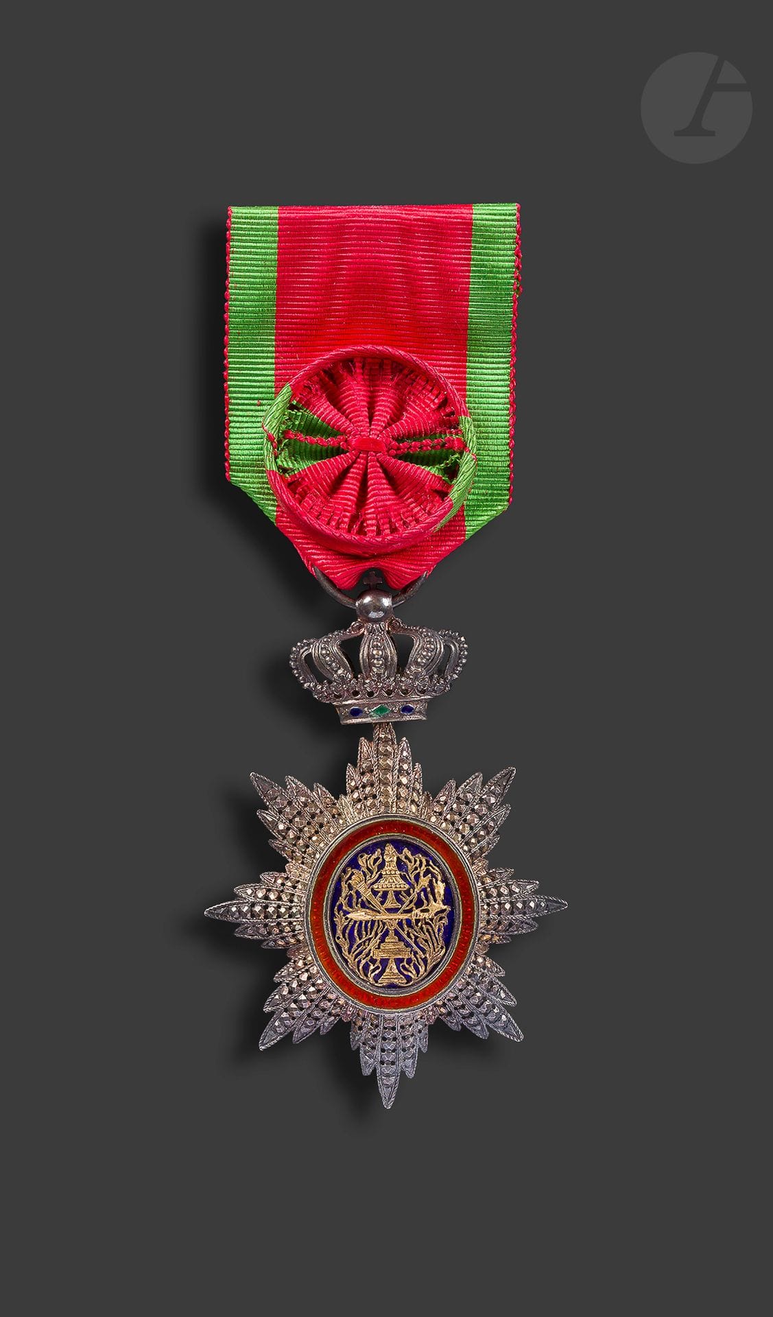 CAMBODIA 
ROYAL ORDER 
Officer's Star. In vermeil, spotted. Enamelled centre. Ribbon of the 1st type with rosette. Swan stamp.
78 x 46 mm - Gross weight : 28 g G
.
 
T.B. to SUP

.


