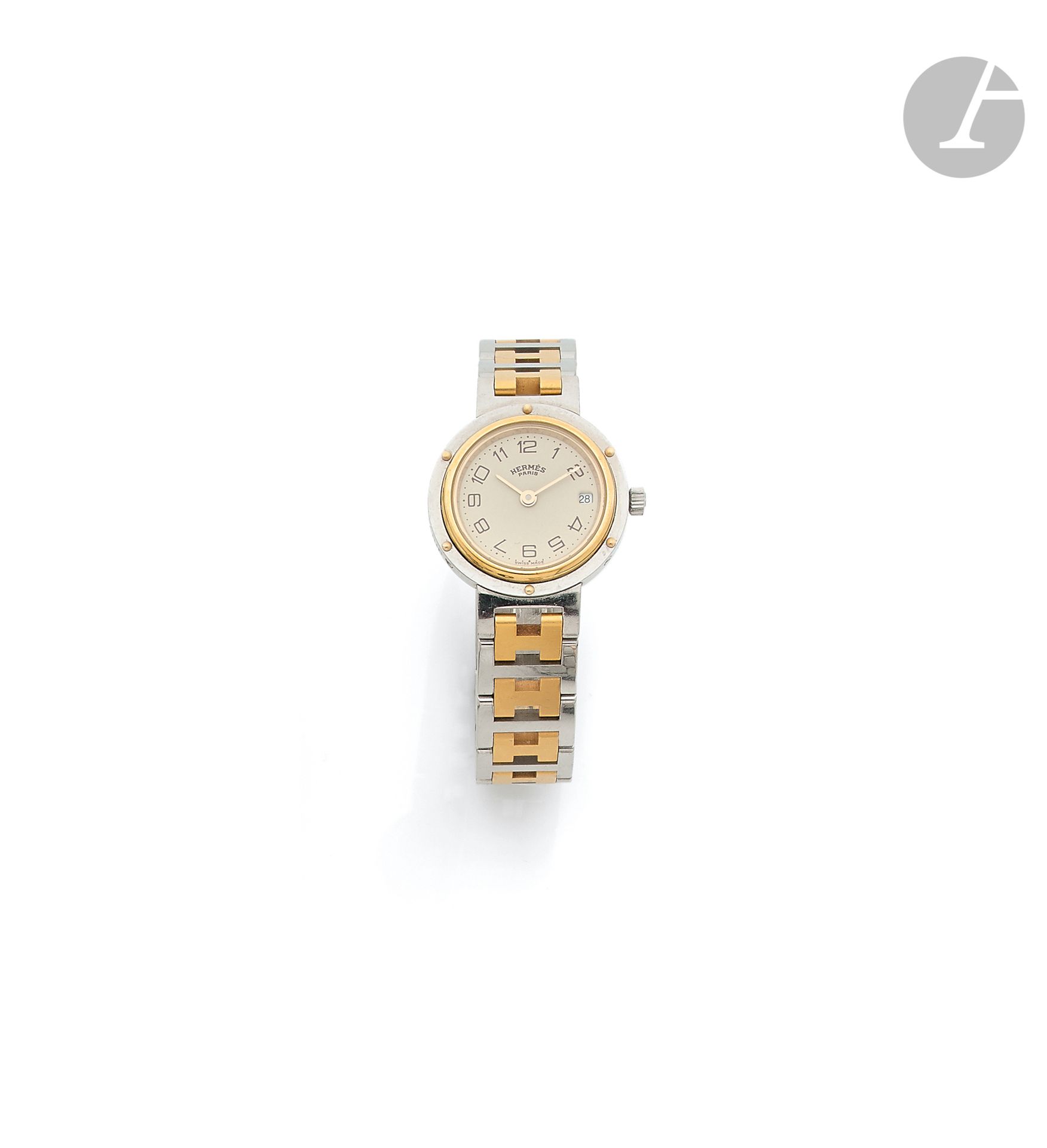 HERMèS. Circa 1988No.

170904Women's gilt metal and steel wristwatch, white dial with Roman numerals forming the hours, date window at 3 o'clock, quartz movement (battery not verified), gilt metal and steel bracelet with its signed buckle. 
Dial, case and movement signed. 
Diameter: 24 mmThe
watch comes with its case and papers
.



