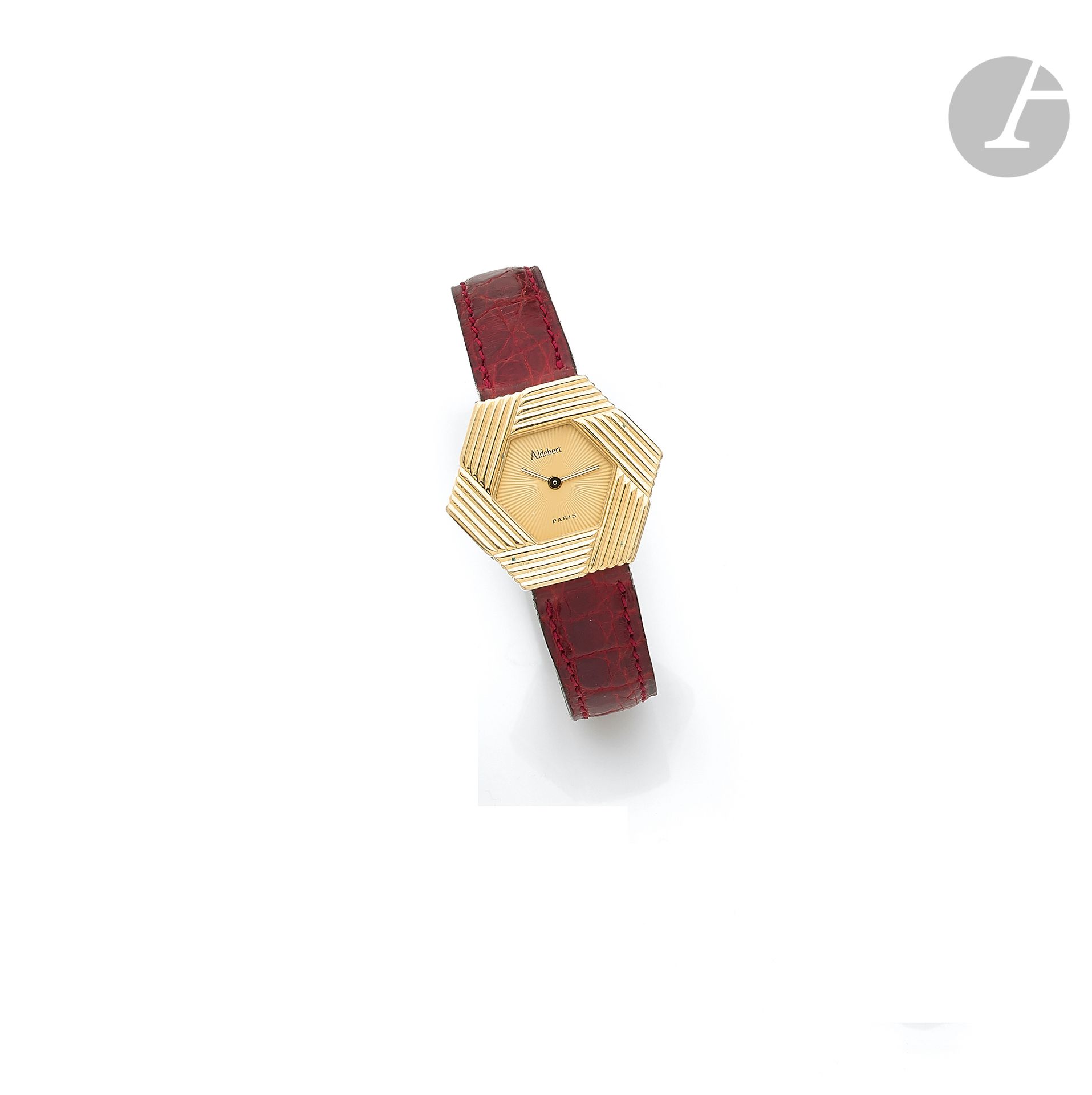 ALDEBERT. Circa 1990No.

100458Women's 18K (750 ‰) gold wristwatch, gilt hexagonal dial, quartz movement (works), leather strap with its signed gilt metal pin buckle. 
Dial, case and movement signed. 
Gross weight: 22.1 g



