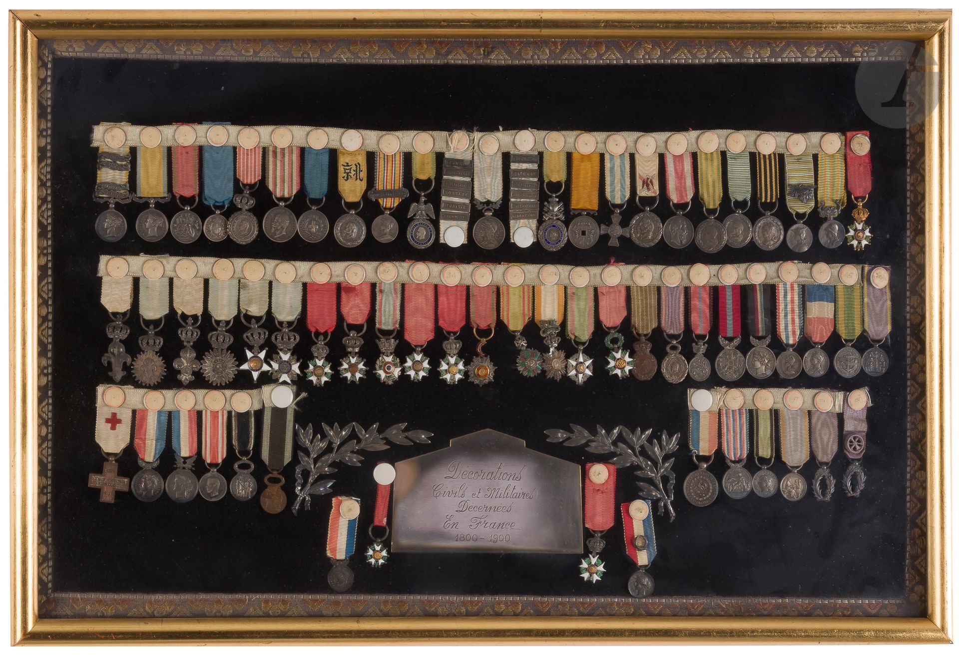 CIVIL AND MILITARY DECORATIONS AWARDED IN FRANCE 1800-1900Important
and beautiful collection of 63 miniatures of French and foreign orders and commemorative medals. 
Height : between 15 and 20 mm 
Crimea medal with 4 clasps "Alma", "Balaklava", "Sebastopol", "Inkermann", Baltic, Ottoman Crimea medal for Sardinia, Sardinian military valor, Italian campaign 1st type, Italian unity commemorative, China Expedition (1860), military medal 2nd type and III Republic, Colonial medal with two ribbons of 12 clasps in all (including Nossi-Be, Gold Coast, Society Islands), Taï-Ping, Mentana, Mexico medal, Tonkin medal, Madagascar (1883-1886), Dahomey, Madagascar (1895) with clasp, China (1901), officer of the Legion of Honor in gold and enamel, decoration of the Lily, Lily of bodyguard, Lily under crown, lily type bodyguard, decoration of Fidelity, cross of the Lily, knight of the Legion of Honor Restoration, Cross and medal of July, knight LH II Republic, knight LH II Empire, knight of Medjidié, knight Nichan Iftikhar, knight Dragon of Annam (lacking the center, agricultural merit, medal of Saint Helena, society of the debris of the Great Army 3rd type, medal known as "the branch of Holly", medal of July, academic palms, medals of Mutuality, medal of Zeal in the profile of Nicolas II. 
Silver, bronze, gold and enamel. Ribbons. 
Presented framed under glass (not faded).
T.B. to SUP.





