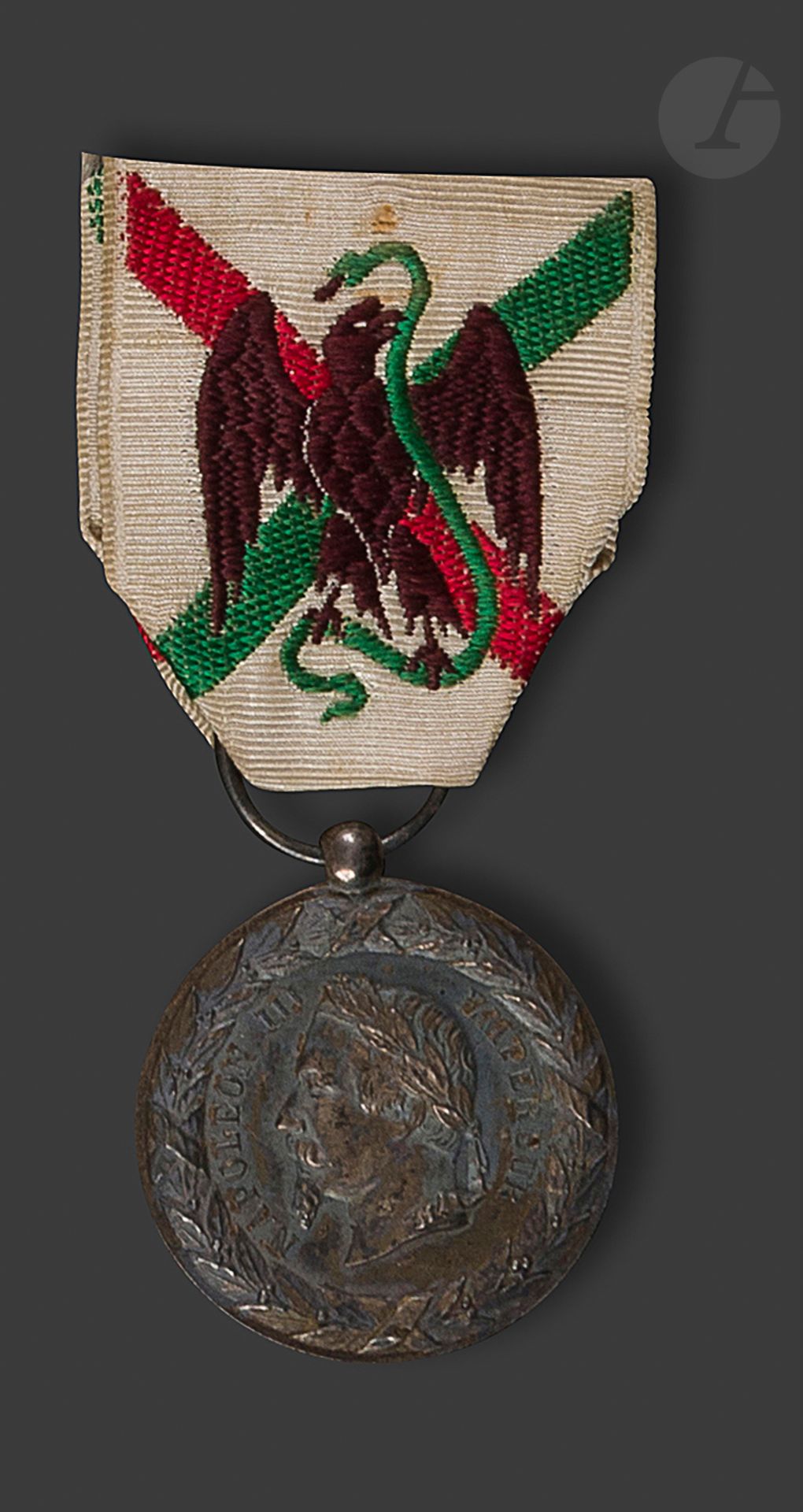 FRANCE 
Silver medal of Mexico. 
Ribbon woven with an eagle. Eagle head hallmark. 
29 mm - Gross weight: 17 gT
.T.B. to SUP. 
Provenance: General Jules JOLLIVET (1834-1914).
Had made the campaign of Mexico of September 4, 1862 to February 12, 1867. 
He was also awarded the order of Our Lady of Guadalupe.






