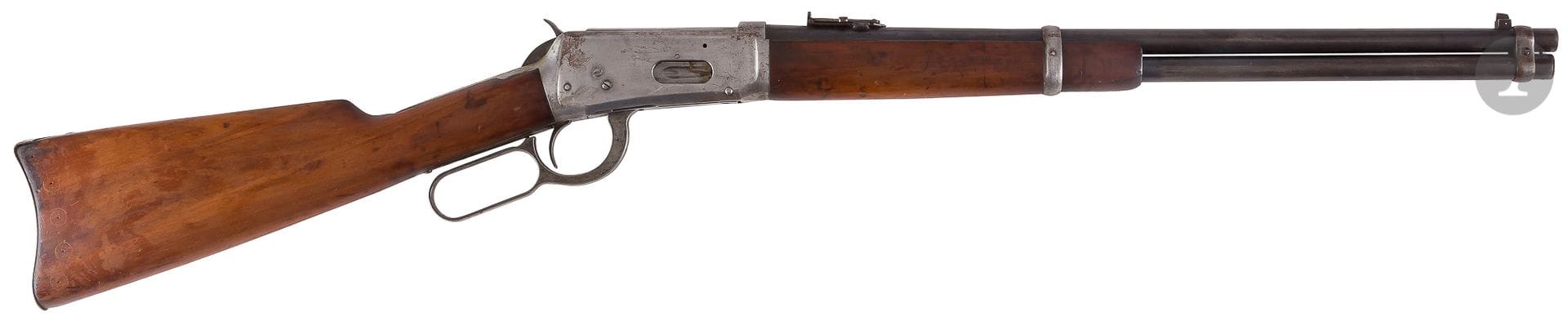 Winchester Model 1894 AF Saddle Rifle, Caliber 30 W.C.F, used by the French Army. 

49 cm rifled rebronze barrel with markings and metre rise. Plain breech case, breech tail with markings. 

Saddle ring, butt plate, front and rear iron grenadier. 

Walnut stock (traces of old studding removed). 

Total length: 97 cm 

(Small punctures). 

Category C to be declared, N° 671529.



Nearly 15,000 Winchester Model 94 were issued to the French Army during WWI, mainly to the French Army of the Train. 



These rifles were manufactured in New Haven in 1913 for the majority. Their serial number is in the order of 600 000 to 700 000.