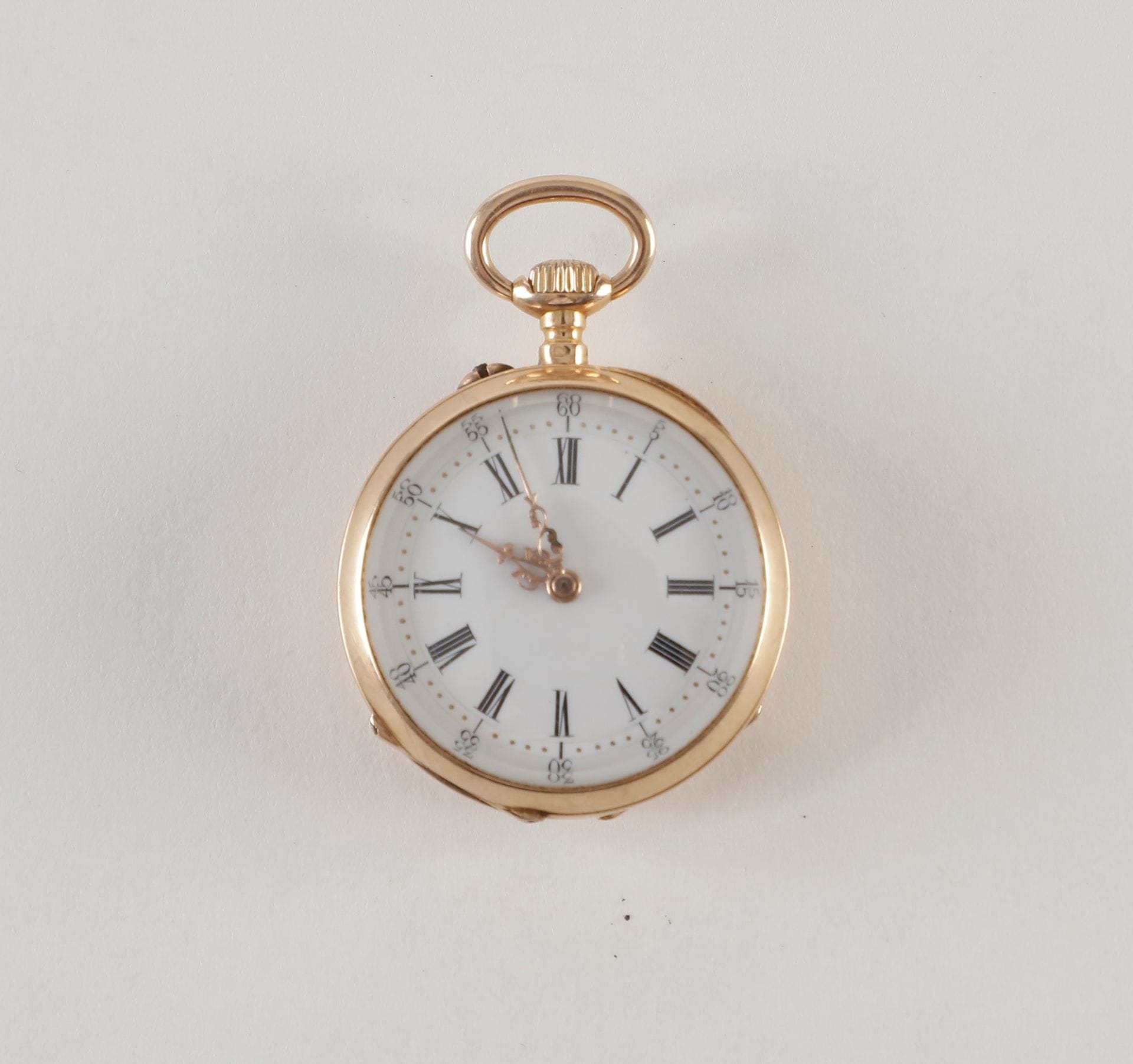 Le Coultre. Une montre de poche en or (18K) double paroie. 
Poids : 20 g 
Diam : 2,9 cm