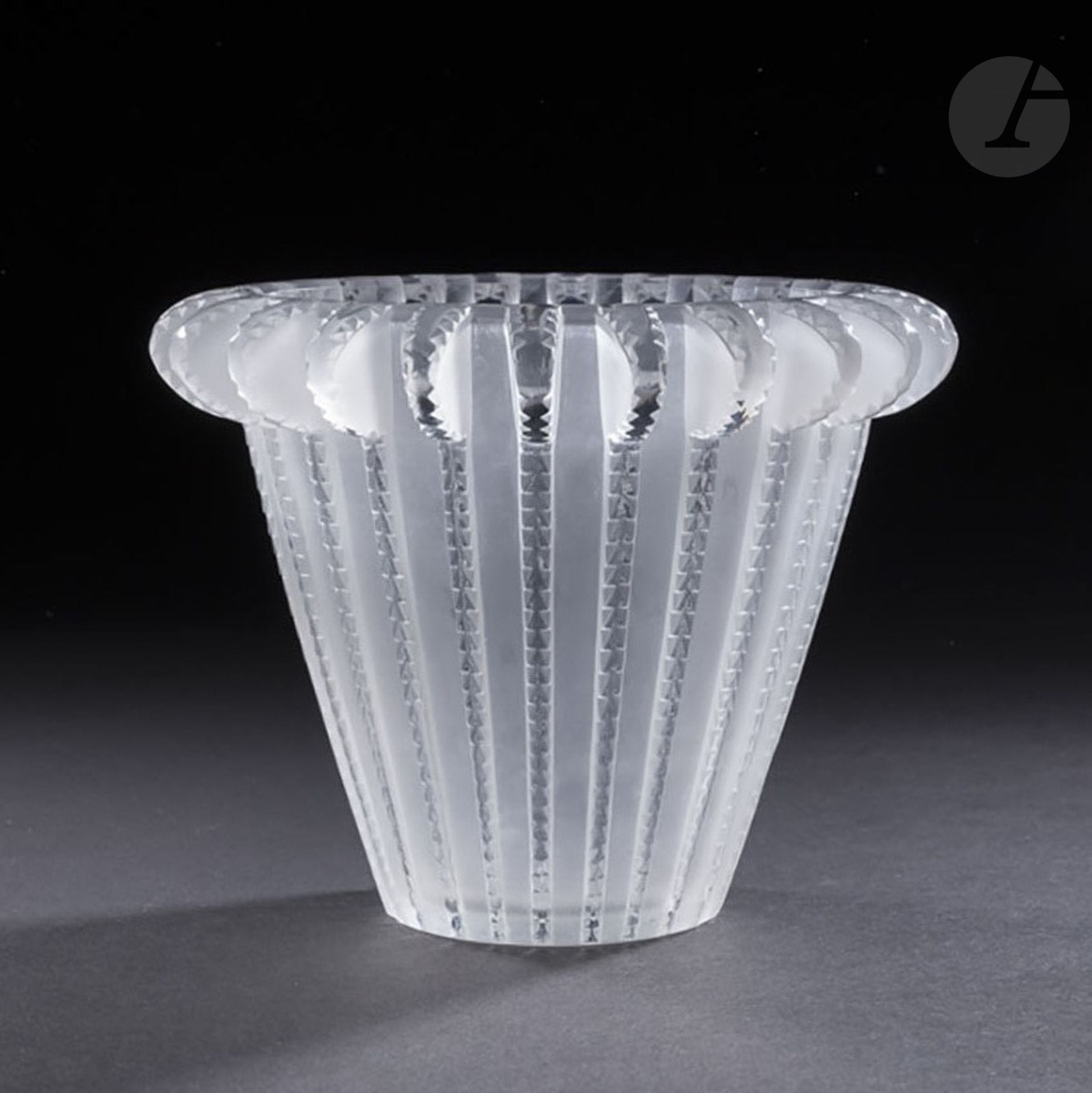 RenÉ LALIQUE (1860-1945) OU MAISON LALIQUE D’APRES RenÉ LALIQUE (1860-1945) 
Royat, le modèle conçu le [28 mars 1936]
Vase cornet. Épreuve en verre blanc moulé-pressé en partie satiné. (Réf. Marcilhac 10-921). Signature non localisée. H. 15,5 cm