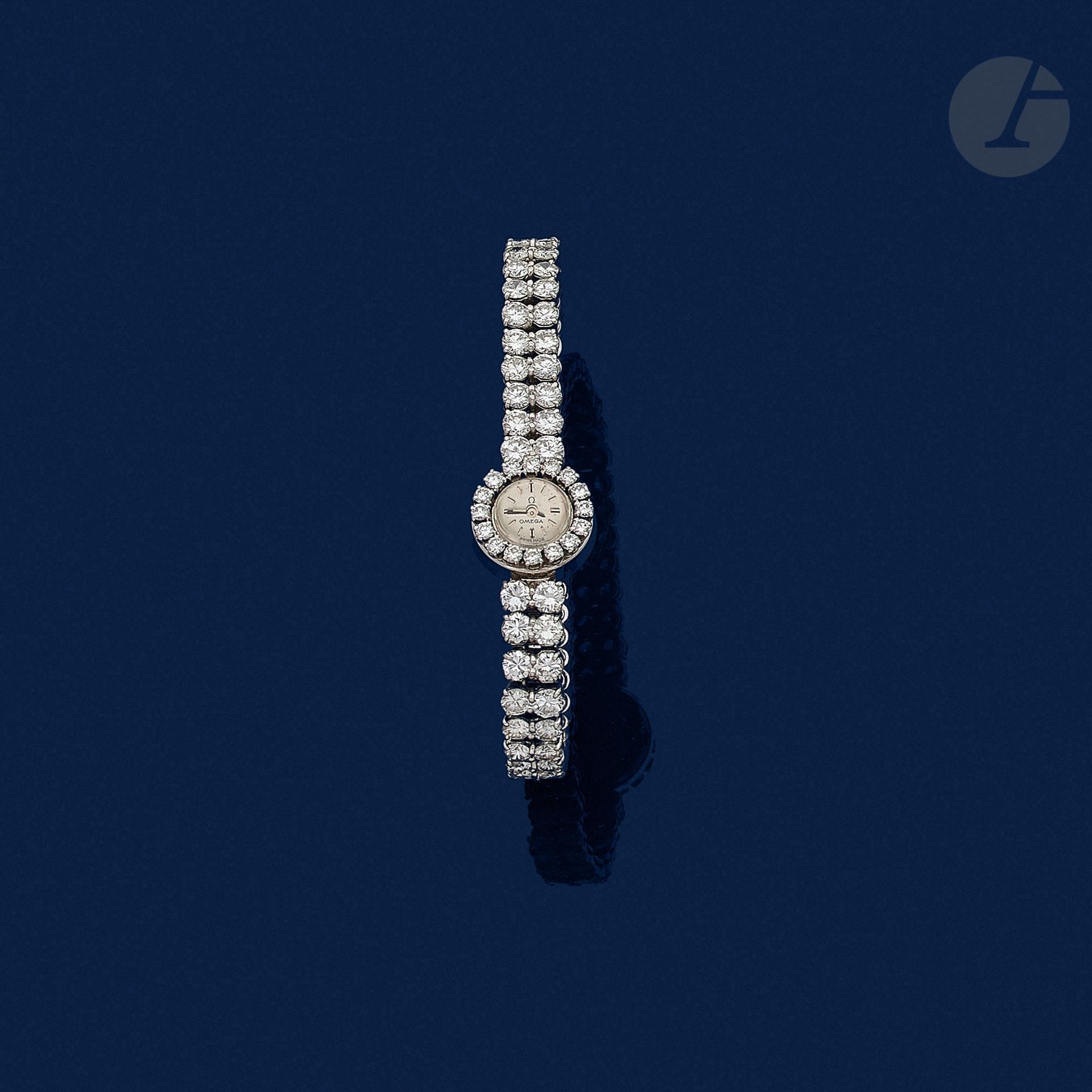 OMEGA

Montre de dame en or gris 18K (750) et platine, cadran rond serti de diamants ronds de taille brillant, bracelet articulé en or gris 18K entièrement serti de diamants de poids croissant, mouvement mécanique. Dans son écrin. Longueur :  16 cm environ. Poids brut : 25 g (égrisures, mouvement à réviser)



An Omega lady’s wrist watch set with diamonds