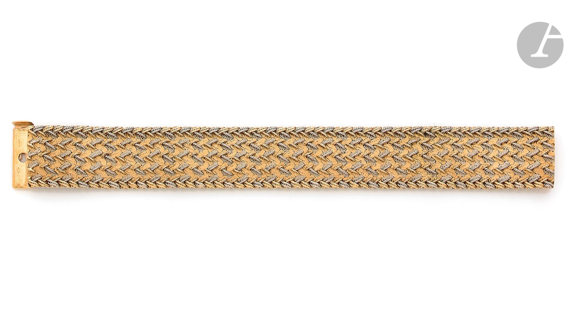Bracelet ruban en ors de couleurs 18K (750) tissés. Travail français des années 1960. Dimensions : 18,5 x 2,1 cm environ. Poids : 88,6 g



A french 1960 bracelet