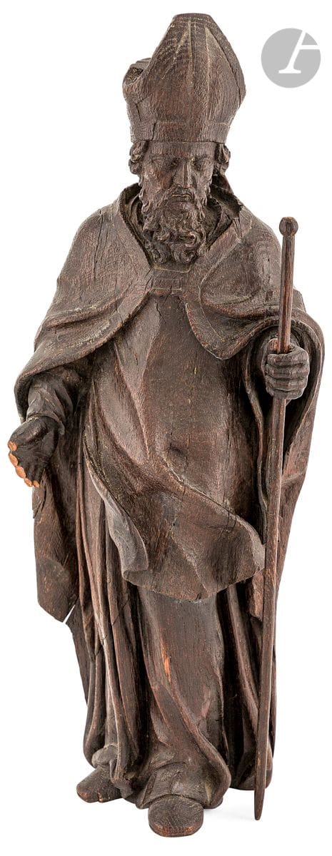 Carved oak Saint Bishop, rough back.
Northern France or Flanders, 17th century
H : 61,4 cm
(in three parts, later staff, small missing)