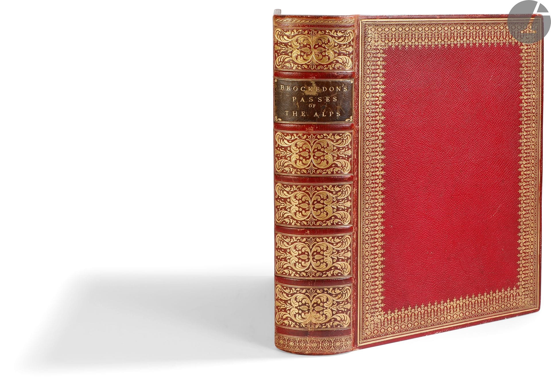 *BROCKEDON (William).
Illustrations of the passes of the Alps, by which Italy communicates with France, Switzerland, and Germany.
Londres : pour l’auteur, Rodwell, J. et A. Arch, Colnaghi et fils, F.G. Moon, Simpkin et Marshall, Walther, 1828-1829. — 2 tomes en un volume fort in-4, 290 x 210 : I. (3 ff.), 14 pp., 8 planches, 1 carte ; 16 pp., 8 planches, 1 carte ; 16 pp., 8 planches, 1 carte ; 16 pp., 8 planches, 1 carte ; 16 pp., 8 planches, 1 carte ; 14 pp., 8 planches, 1 carte ; II. (2 ff.), 16 pp., 8 planches, 1 carte ; 12 pp., 8 planches, 1 carte ; 16 pp., 8 planches, 1 carte ; 16 pp., 8 planches, 1 carte ; 16 pp., 8 planches, 1 carte ; 28 pp., 8 planches, 2 cartes. Chagrin rouge, large roulette dorée en encadrement sur les plats, dos à nerfs richement orné, triple filet doré intérieur, tranches dorées (reliure de l’époque).
Édition originale de cet ouvrage important sur les Alpes du peintre, écrivain et inventeur William Brockedon (1787-1854). Il y donne la description de 12 cols qu’il parcourut en 1824 et 1825 à la recherche de la route d’Hannibal.
L’ouvrage est divisé en 12 parties, chacune comprenant de 12 à 28 pages de texte et 8 gravures et 1 carte, sauf pour la dernière qui comporte 2 cartes. On compte ainsi 96 planches gravées sur acier d’après les dessins de l’auteur et 13 cartes dont une dépliante représentant les Alpes.
Les 12 cols décrits et représentés sont les suivants : Le Petit-Saint-Bernard – Le Mont Genèvre – Le Mont-Cenis – Le Saint-Gothard – Le Grand Saint-Bernard – Le Stelvio – Le Corniche – Le Grimsel et Gries – Le Bernardin et le Splugen – Le Brenner – Le col de Tende et l’Argentière – Le Simplon.
Reliure anglaise de l’époque. 

Exemplaire en grande partie dérelié, la charnière intérieure du premier plat étant entièrement fendue. Frottements d’usage. Rousseurs. Ex-dono manuscrit en anglais au verso de la première garde, daté du 6 mars 1838.
