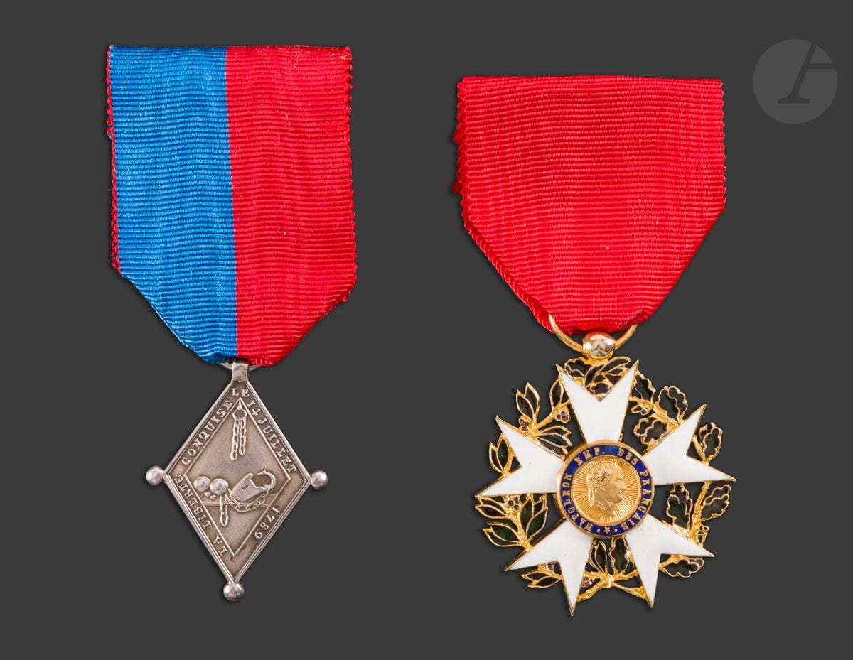FRANCE 
Médaille des vainqueurs de la Bastille (1789). 
En argent. Ruban aux couleurs de la ville de Paris. Poinçon de la Monnaie. 
37 x 25 mm - Poids net : 8 g 
SUP. Frappe du XXe siècle. On y joint une copie moderne d’étoile d’officier du 1er type du 1er Empire.