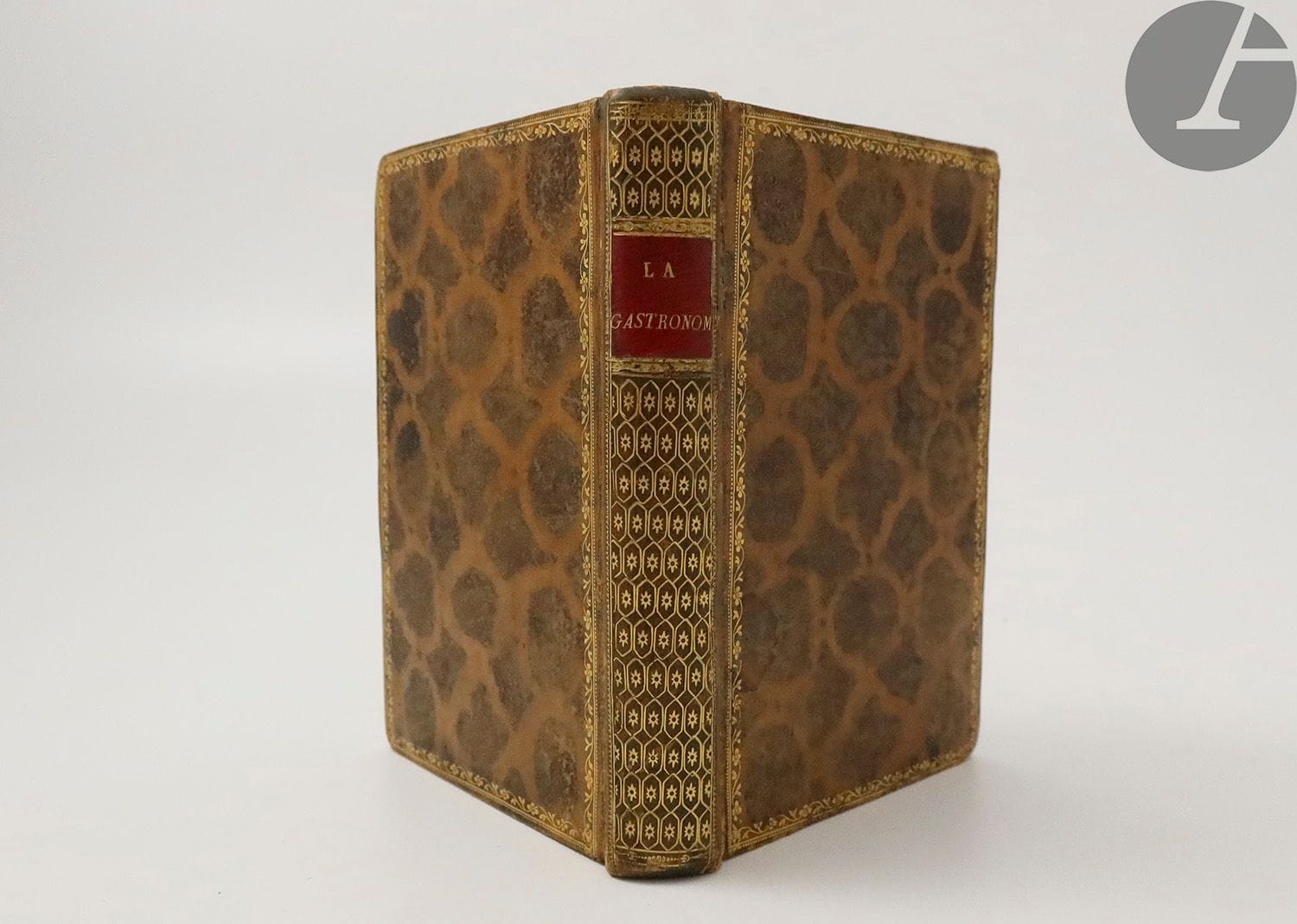 BERCHOUX (Joseph).
La Gastronomie, poem... followed by the author's fugitive poems. Fourth edition, corrected and increased.
Paris : Giguet et Michaud, 1805-An XIII. - In-18, havana calf, gilt roulette on the edges of the boards framing a decoration of compartments made with acid, smooth spine richly decorated, gilt edges (period binding).
Fourth edition of this famous poem which has become one of the "classics of the table", the first to include the author's name in all letters, illustrated with a frontispiece engraved by Delignon after Silvestre David Myris and 3 plates engraved by Bovinet, Baquoy and Delvaux after Monsiau and Myris.

Beautiful copy in contemporary binding. 
One corner dulled. Stains on the frontispiece and the edge of the first leaves.





