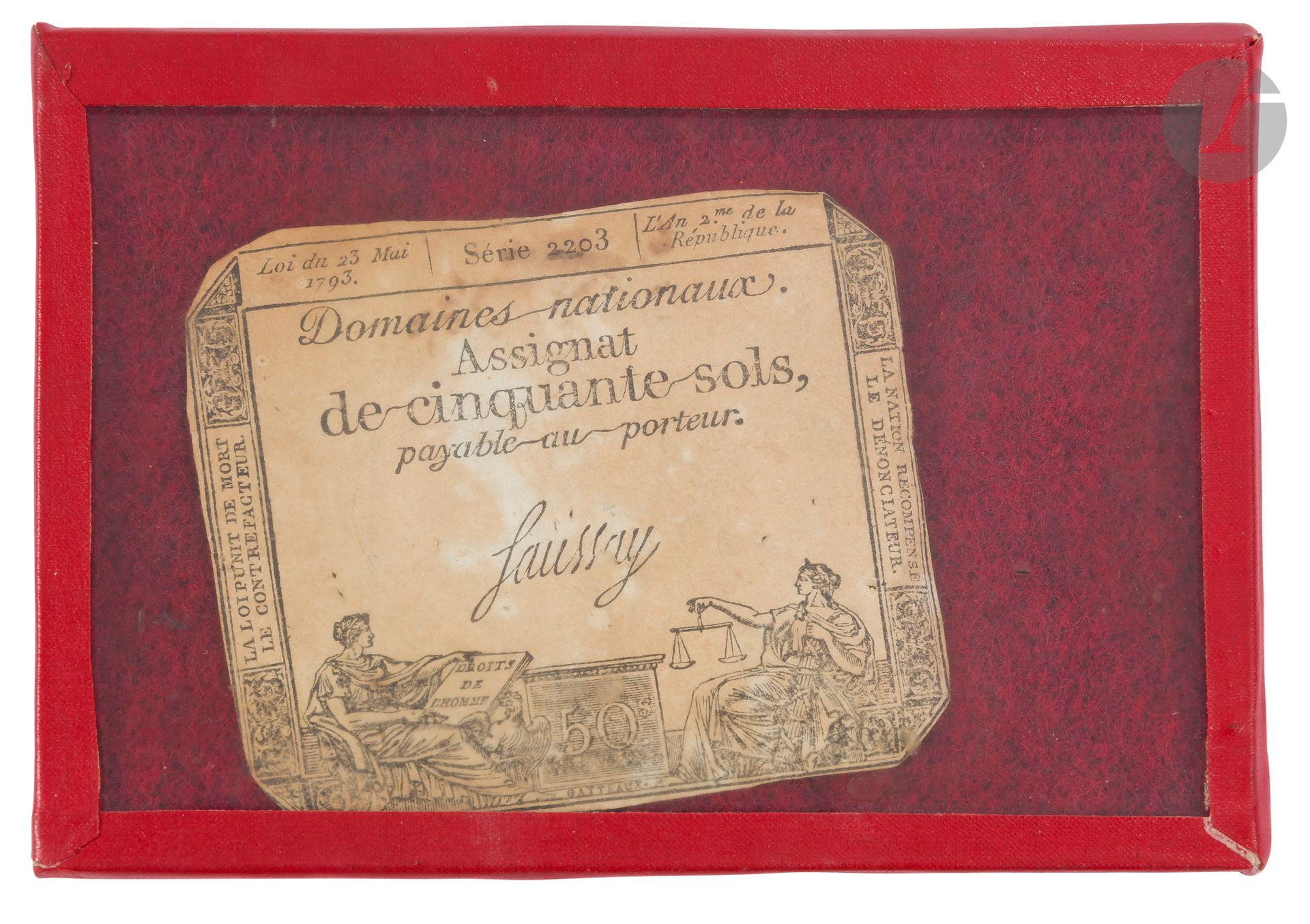 Assignat de cinquante sols. 
« Loi du 23 mai 1793 série 2203, l’an 2e de la République », « La Loi punit de mort le contrefacteur ». « La Nation récompense le dénonciateur ».
Sous verre. (Rousseurs).