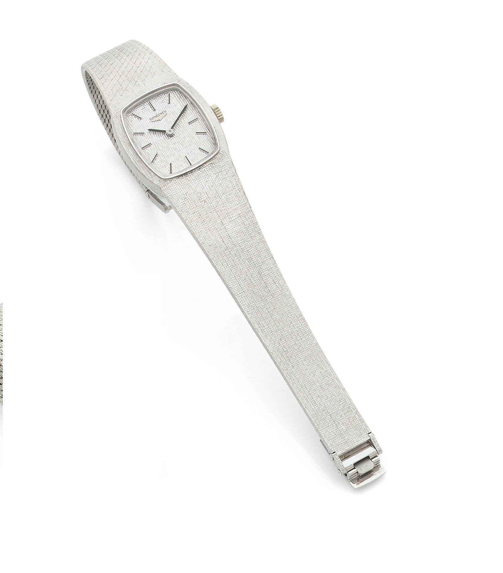 LONGINES. Circa 1970No.

17187954Women's 18K (750) white gold wristwatch, gray dial, applied baton numeral hour markers, mechanical winding movement caliber 5601, integrated 18K white gold bracelet with signed buckle.
Dial, case and movement signed.
Length: 18
cmGross
weight
: 58.1 g




