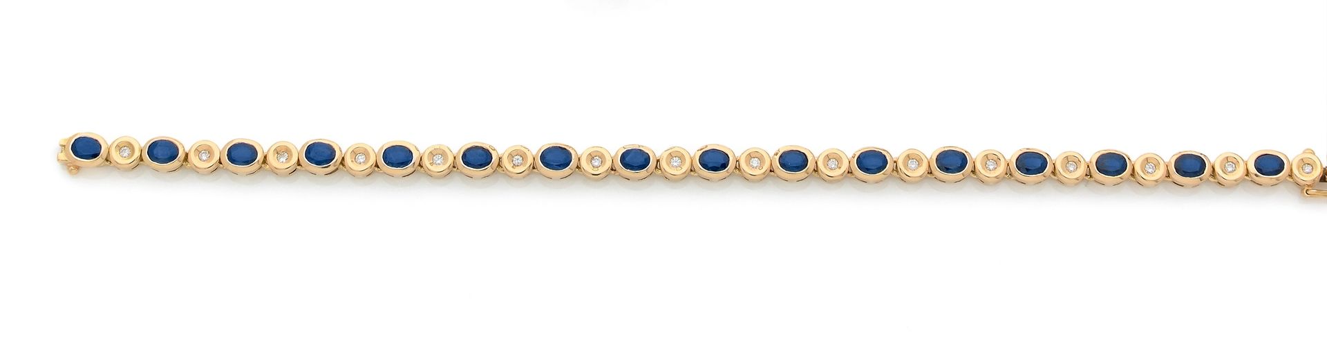A line bracelet in 18K (750) gold, set with oval sapphires and round brilliant-cut diamonds. Length: 19 cm approximately. Gross weight : 22,6 g

A sapphires and diamonds bracelet