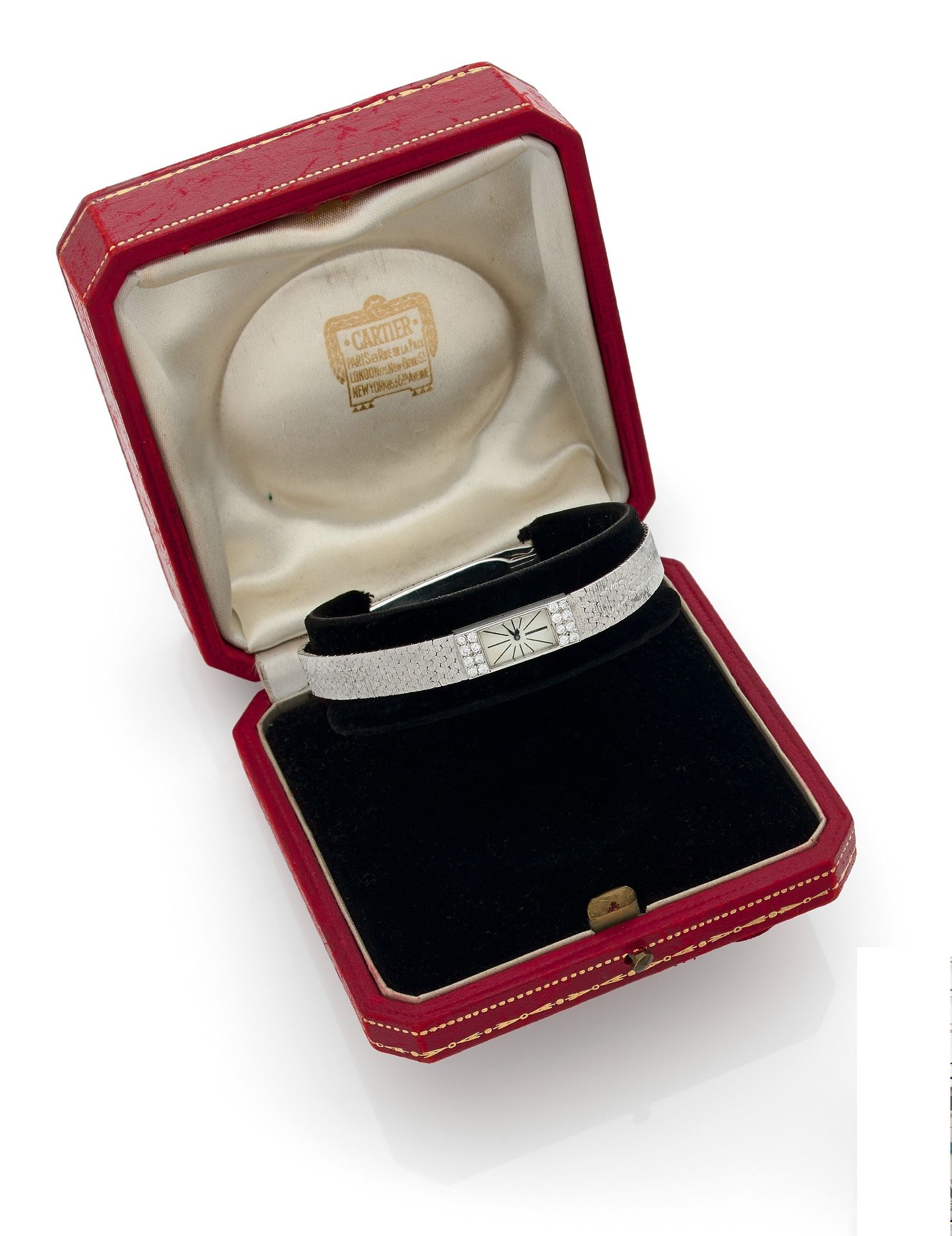 CARTIER. Circa 1950No.
47040 -
10152Women's 18K (750) white gold wristwatch, bezel set with brilliant-cut diamonds, white dial, painted baton hour markers, duoplan mechanical winding movement, 18K gold bracelet with folding clasp numbered 3751.
Case and movement signed.
Dimensions: 8 mm x 19
mmGross
weight
: 17.2 gThe
watch comes with its case.





