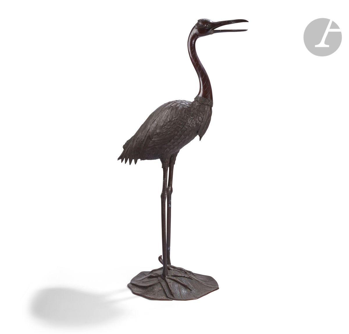 Large bronze tsuru, Japan, Meiji period (1868 - 1912)
With brown patina, the tsuru (red-headed crane) standing, the beak slightly open in which was originally a flowering branch.
Height : 116 cm