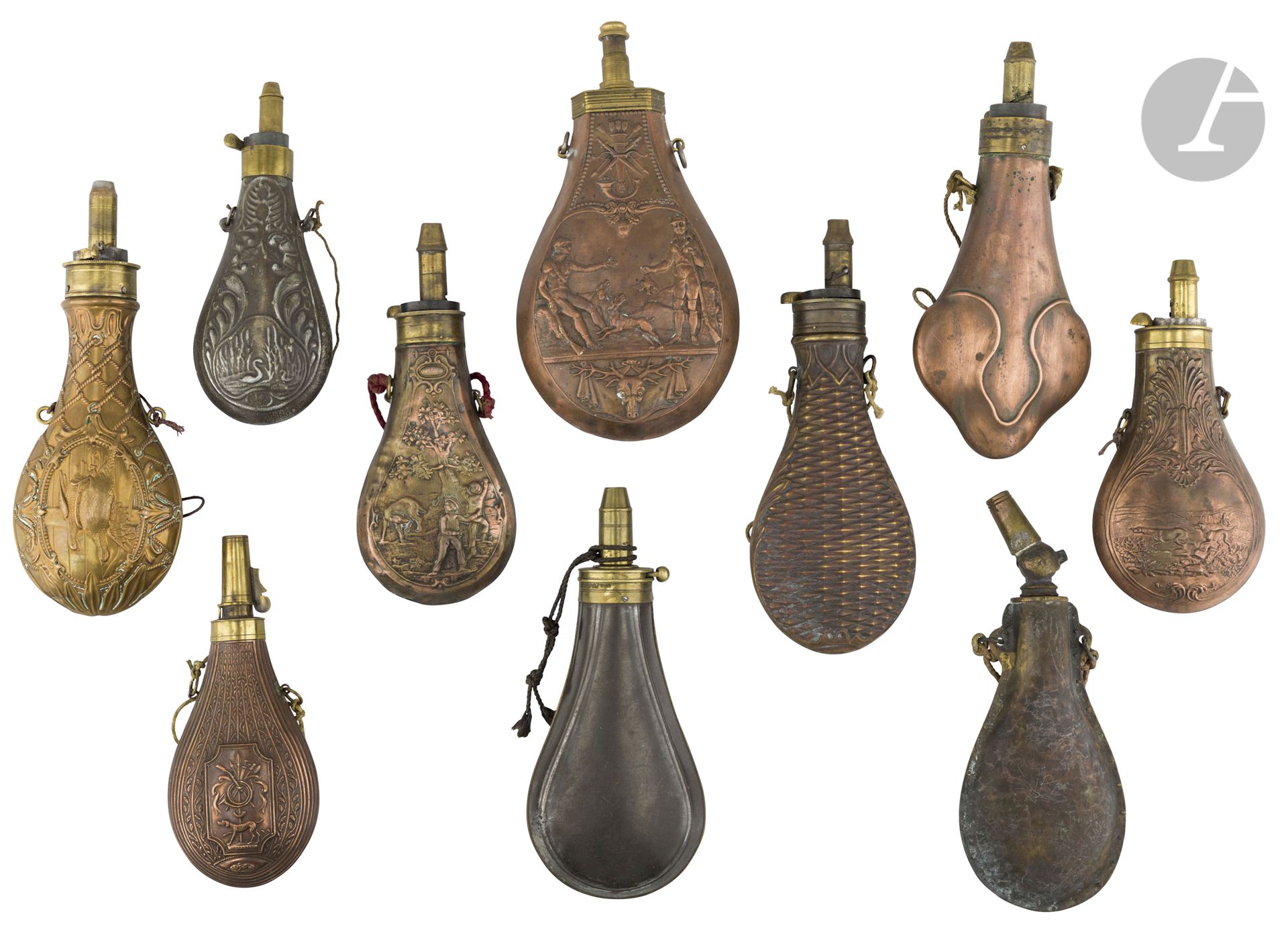 Lot of 10 powder flasks in copper, brass and sheet metal{CR}some decorated with hunting scenes, animals and foliage.